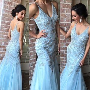 Icy blue floor length gown with silver beading.